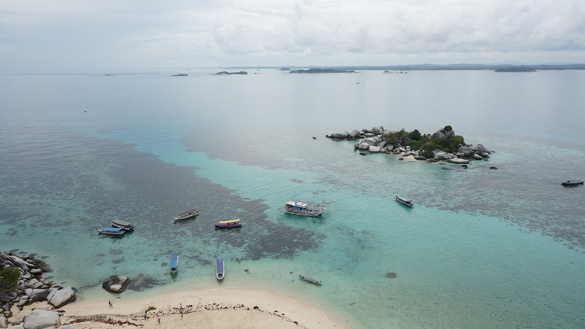 Boats and granite islands viewed from Lengkuas Island