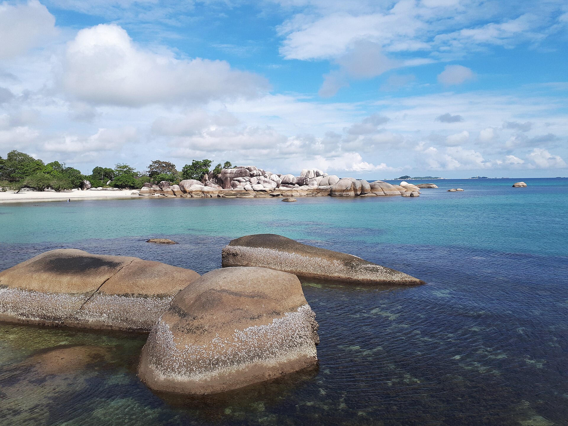 Blue water and granite boulders at Tanjung Tinggi, Belitung